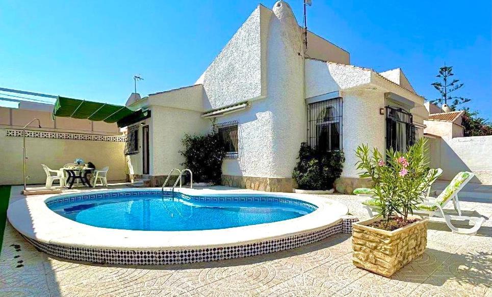 Villa Playa Mil Palmeras Campoamor Bagian luar foto